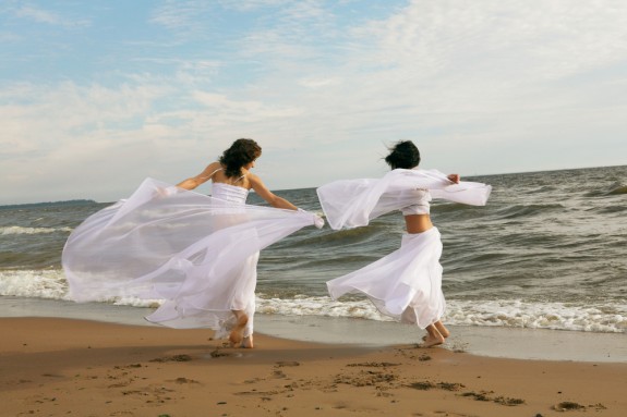 bride running on the beach