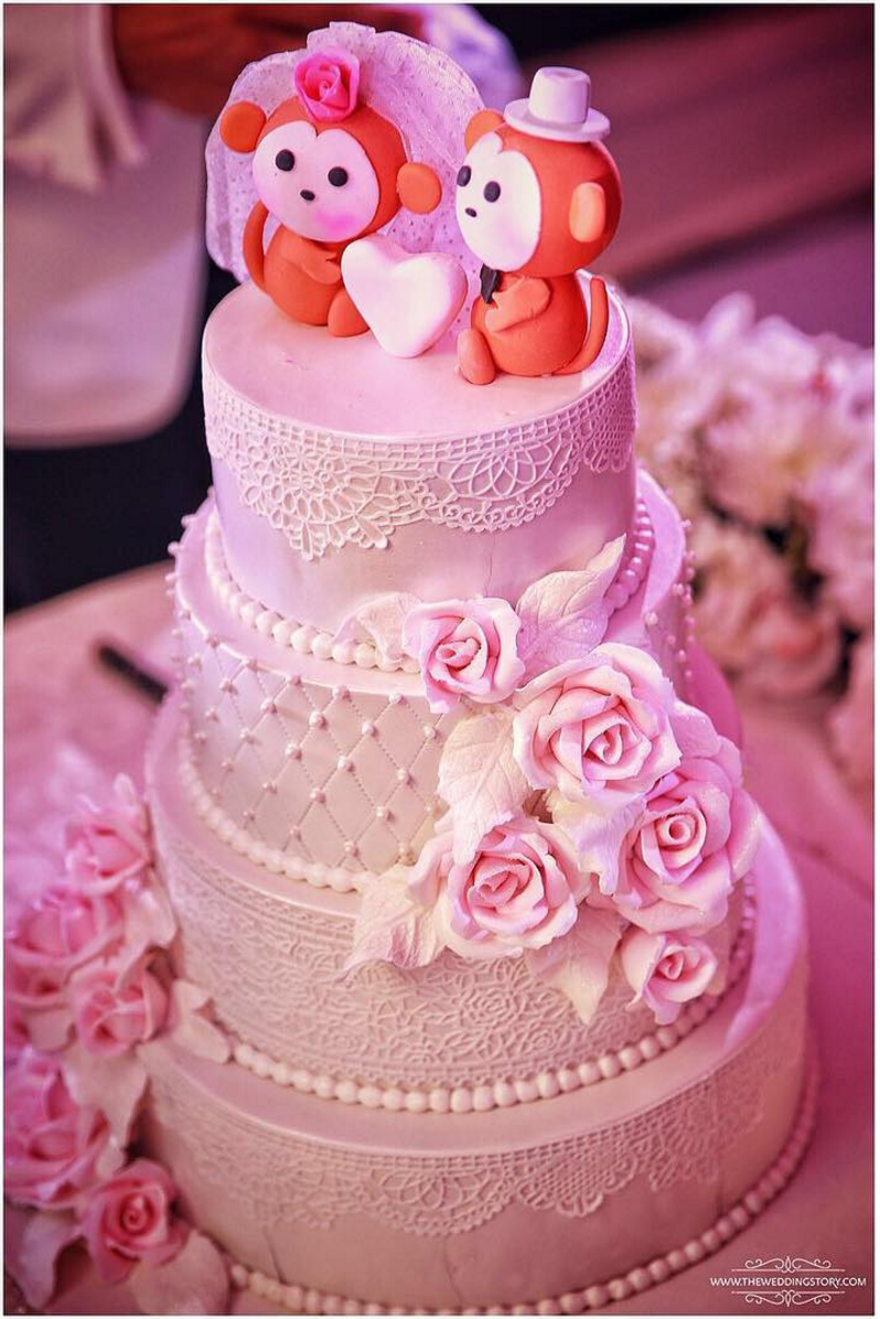 chic wedding cake with monkey cake topper